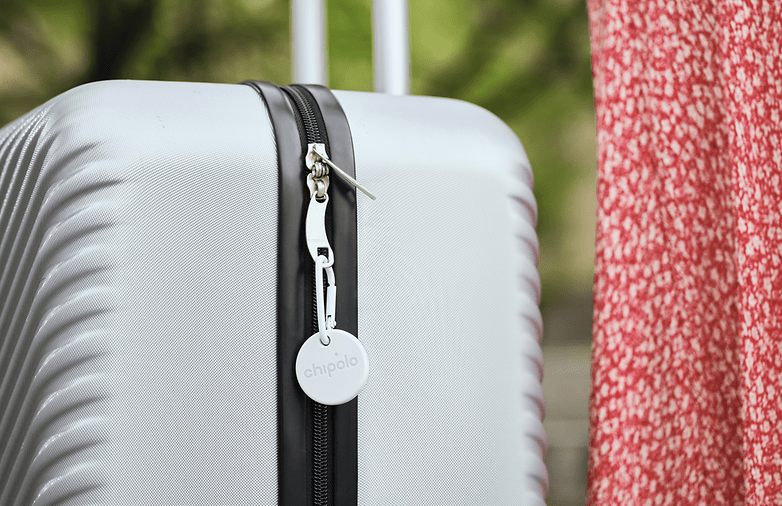 Chipolo One Point item tracker attached to a luggage
