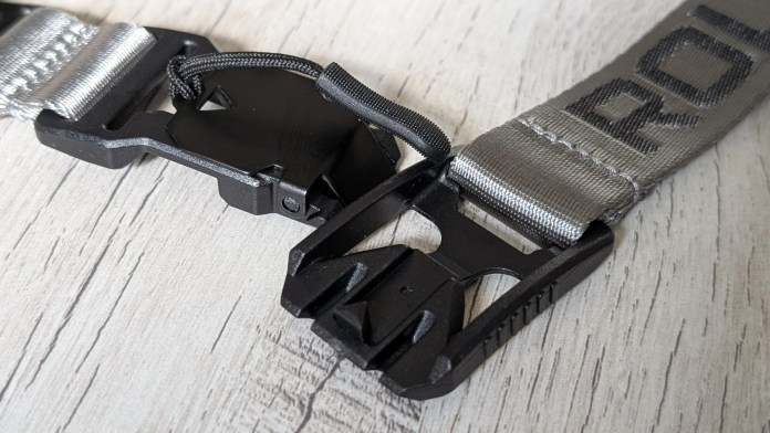 Close-up of the Rolling Square RS Lanyard featuring a magnetic detachable mechanism and nylon braided fabric, with a focus on the clip and strap details.