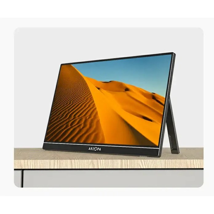Arzopa A1 15.6-inch portable monitor displaying a desert landscape in vibrant colors, positioned on a wooden surface.