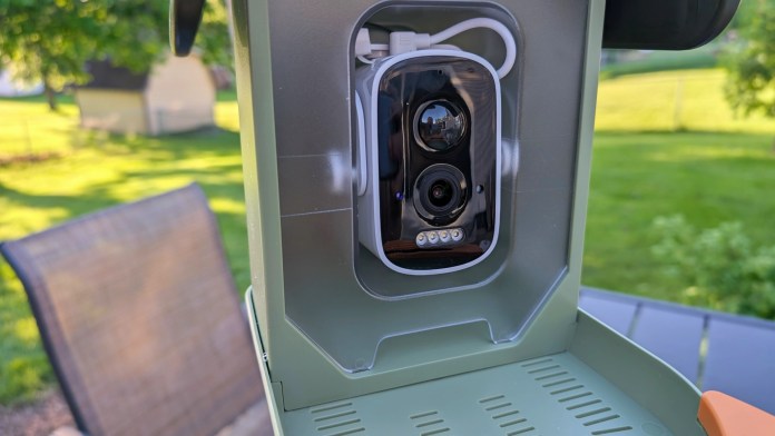 Close-up of the Vinguys Smart Bird Feeder's 5MP camera with infrared night vision, mounted inside the feeder.