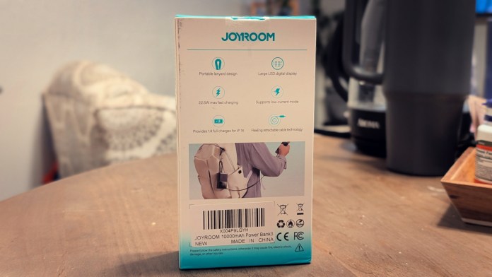 Rear view of the Joyroom JR-PR1 Retractable Power Bank packaging, displaying features such as portable design, fast charging capabilities, and specifications.