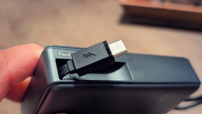 Close-up view of the Joyroom JR-PR1 Retractable Power Bank showing the Type-C cable plugged into the device.