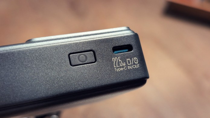 Close-up of the Joyroom JR-PR1 Retractable Power Bank, showing the power button and Type-C input/output port labeled with fast charging specifications.