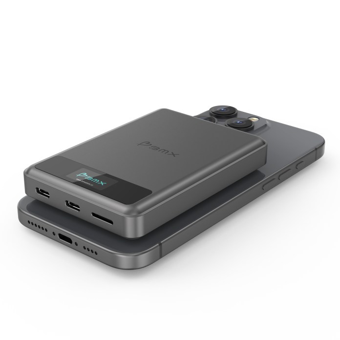 SolidSafe power bank resting on a smartphone, showcasing its sleek design and charging ports.