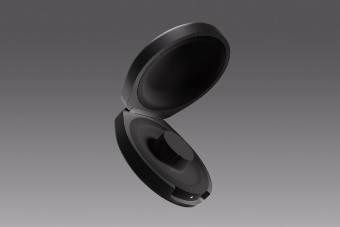 A sleek, open black charging case designed for the Oura Ring, showcasing a smooth, minimalist aesthetic against a neutral background.