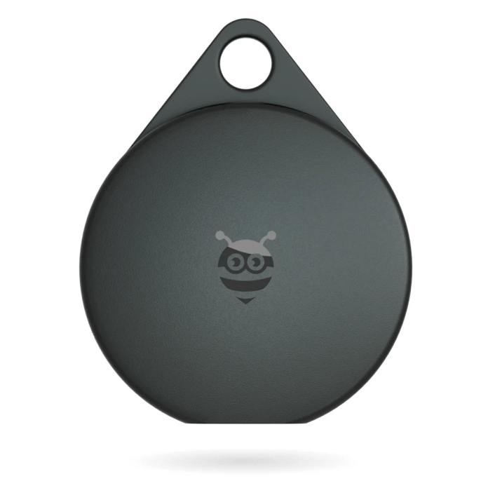 Close-up view of the Pebblebee Clip Universal tracking device in dark color with a logo.