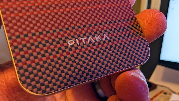 Close-up of the PITAKA Aramid Fiber Magnetic Power Bank, showcasing its distinctive pattern and branding.
