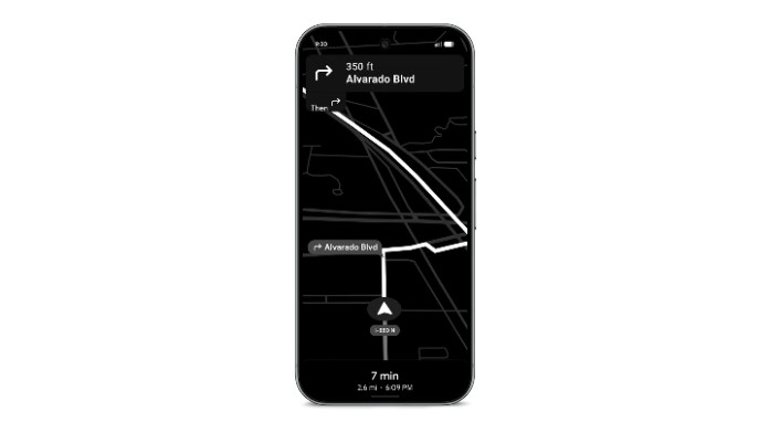 Smartphone displaying navigation directions on Google Maps, featuring a black interface with a route highlighted and estimated time of arrival.