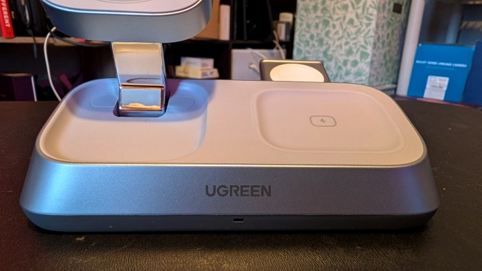 UGREEN MagFlow 3-in-1 Magnetic Wireless Charger on a desk, showcasing its sleek design with a stand for charging Apple devices.