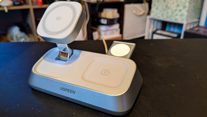 UGREEN MagFlow 3-in-1 Magnetic Wireless Charger on a dark surface, designed for simultaneous charging of an iPhone, AirPods, and Apple Watch.