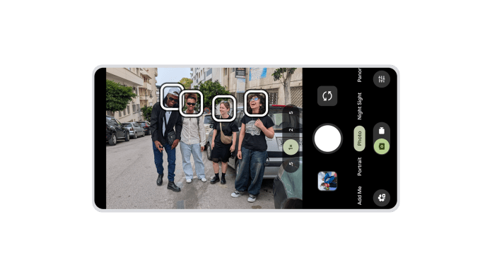 A smartphone camera interface displaying a group of four individuals standing on a street, with facial recognition boxes highlighting their faces.