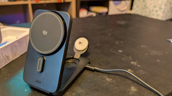 A close-up view of the ESR CryoBoost 3-in-1 Magnetic Charging Station, featuring a Qi wireless charger, an Apple Watch charger, and a sturdy base with a charging cable, placed on a desk.