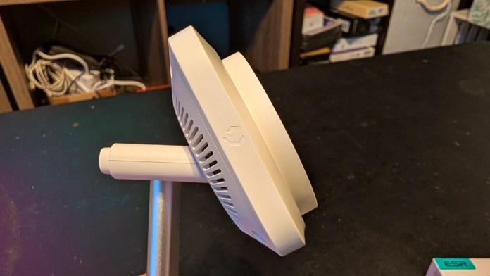 Side view of the ESR CryoBoost 3-in-1 Magnetic Charging Station, showcasing its compact design and adjustable angle for charging multiple devices.