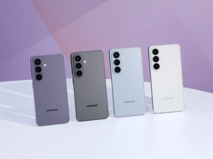 Four Samsung smartphones displayed on a table, featuring colors purple, gray, blue, and white.