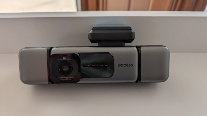A multi-channel dash cam featuring an optical lens and AI technology, designed for vehicle monitoring.