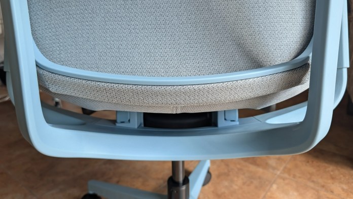 Back view of a modern office chair with a light blue frame and grey fabric cushioning.