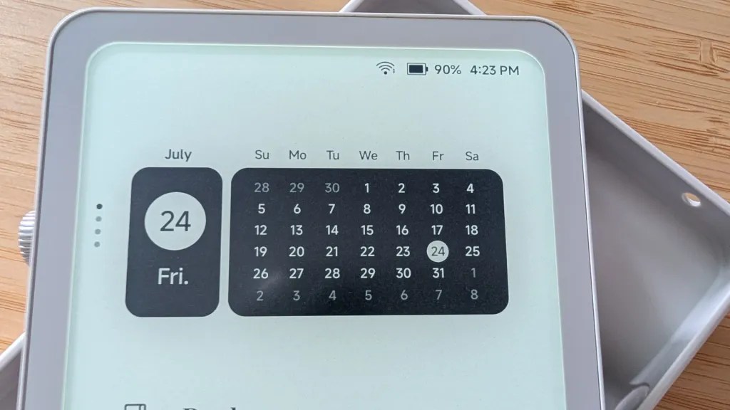 Digital calendar display showing July 24 which is a Friday, with battery level at 90% and time at 4:23 PM.
