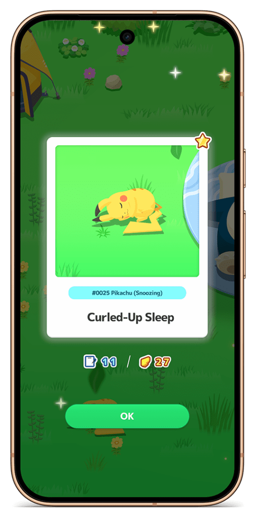 A smartphone screen displaying a sleeping Pikachu in a green environment, with information about its Pokédex number and a description labeled 'Curled-Up Sleep.'