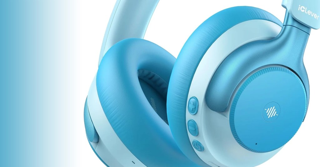 A close-up view of light blue wireless headphones, featuring soft ear cushions and control buttons on the side.